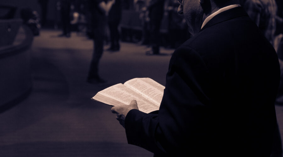 man reading the Bible